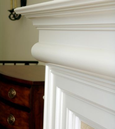 TV on white wall with architectural trim