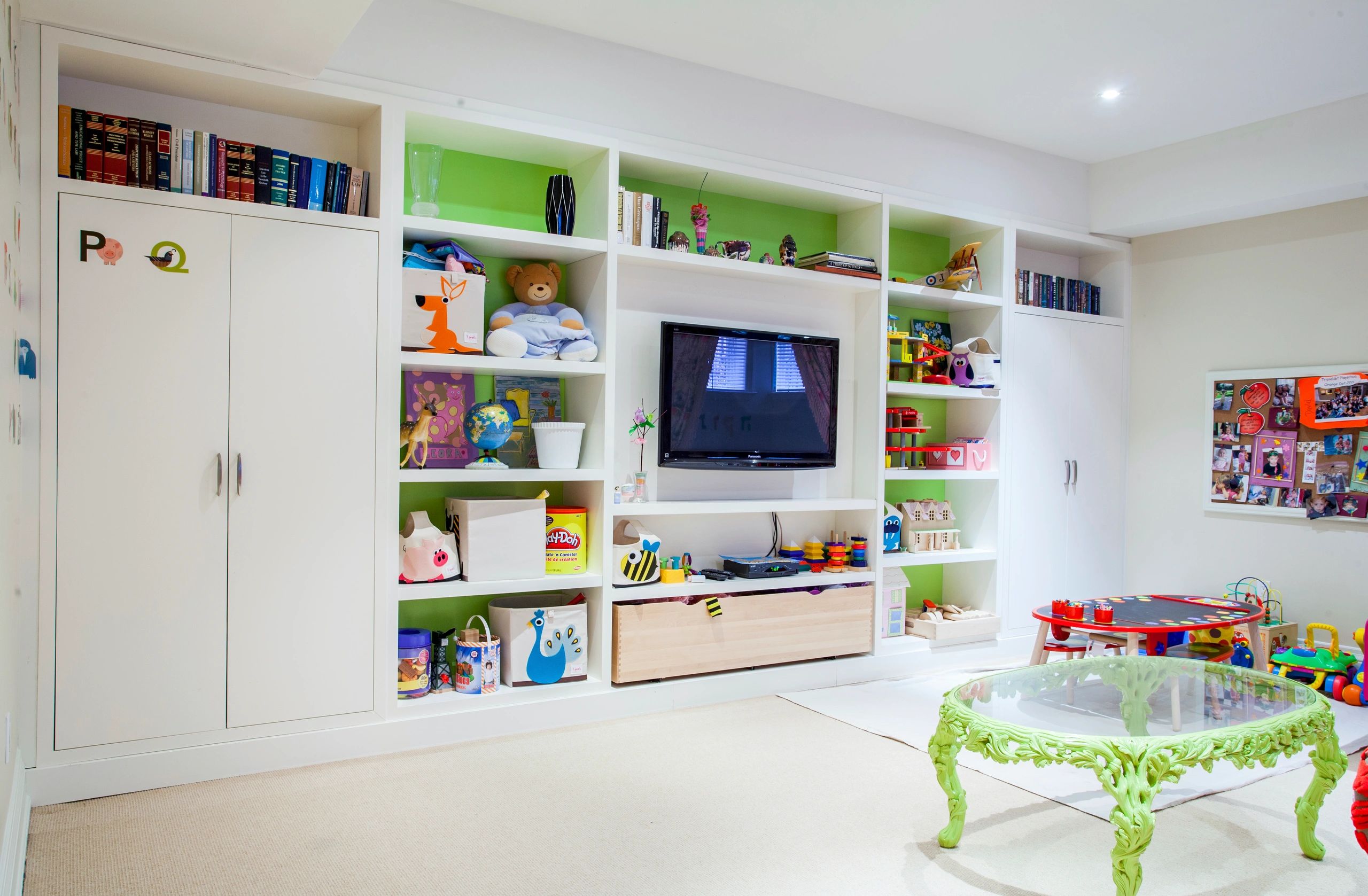 Children's playroom with built-in shelving