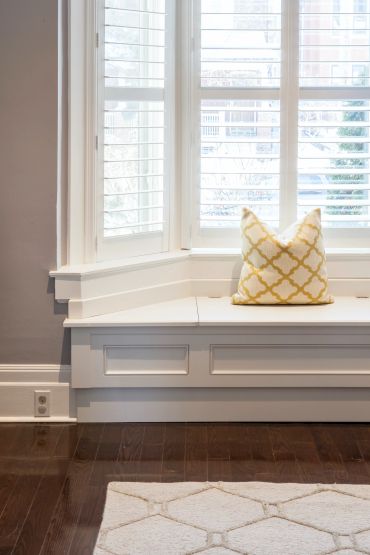 Window seat with geometric pillow